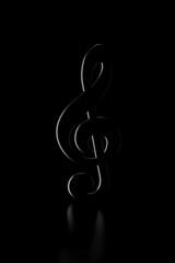 Obraz premium Light and shadow of treble clef sign in the darkness. 3D rendering.