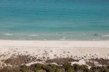 Deserted white sandy beach facing  torquoise sea, Sardinia