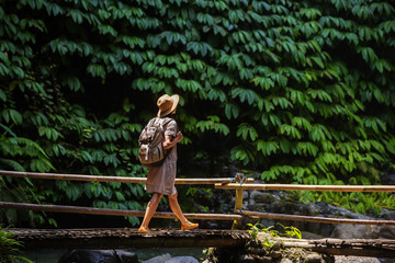 Woman near Nung Nung waterfal on Bali, Indonesia