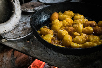 Frying Potatoes in Skillet in Traditional Guatemalan Kitchen
