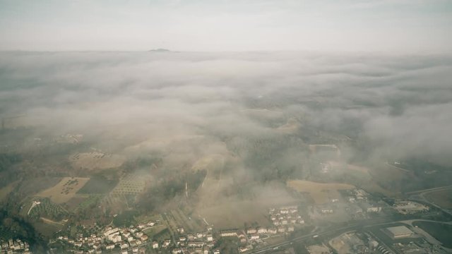 High altitude aerial view of Umbria region near Terni on a cloudy day, Italy