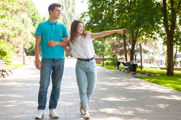 Happy couple having fun together outdoor. Happines, great relationship. Man and woman fooling around.