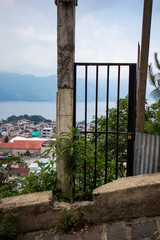 Fototapeta premium Black Gate overlooking San Pedro la Laguna, Guatemala on Lake Atitlan