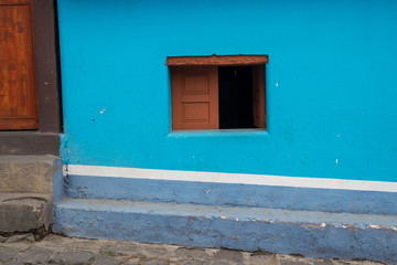 Obraz na płótnie Canvas Small Open Window on Blue House in Guatemala