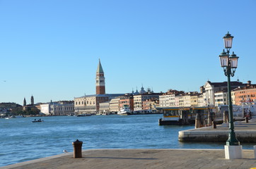 Obraz premium famous cityscape of Venice, aerial view of Piazza San Marco or st Mark square, Campanile and Ducale or Doge Palace, with single gondola and iron lantern in the front, Italy, Europe