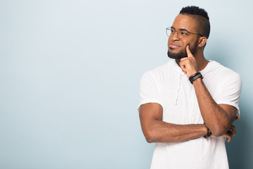 Happy black male looking on copy space, advertising banner.