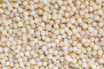 close up of couscous grains background