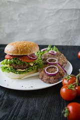 Fresh homemade burger on a white plate. Unhealthy food