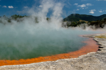 Craze colors shore of the Champagne pool within the Waiotapu geothermal area in the North Island of New Zealand.