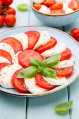 Classic caprese salad. Mozzarella tomatoes and  Basilikum.