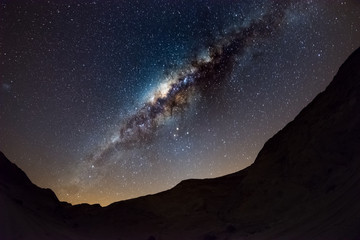 Starry sky and Milky Way arch, with details of its colorful core, outstandingly bright, captured...