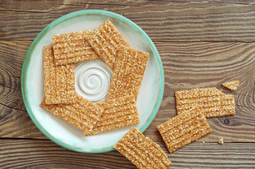 Sesame bars with nuts on table