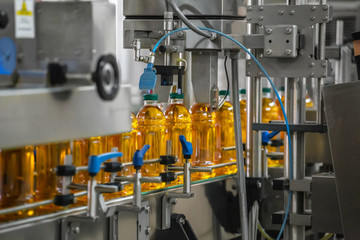 Automatic conveyor belt of production line of juice on beverage plant or factory, modern computerized industrial equipment
