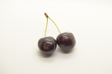 two cherries on white background