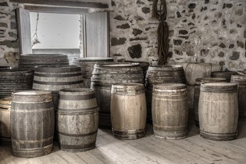 old  wooden barrels in amunition supplies room of old fort