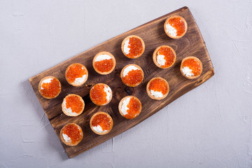 Tartalets with red caviar