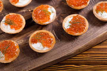 Tartalets with red caviar