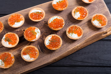 Tartalets with red caviar