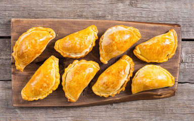 Latin American baked beef empanadas with sauce