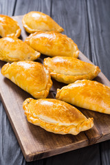 Latin American baked beef empanadas with sauce
