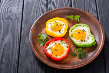 Yellow , red and green pepper with fried eggs