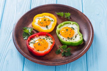 Yellow , red and green pepper with fried eggs
