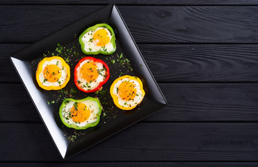 Yellow , red and green pepper with fried eggs