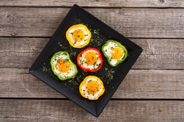 Yellow , red and green pepper with fried eggs