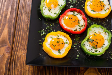 Yellow , red and green pepper with fried eggs