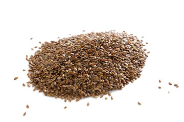 A small hill of flax seeds on a white background isolated.