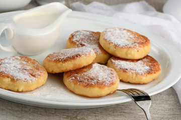 Breakfast. Cheese pancakes with sour cream