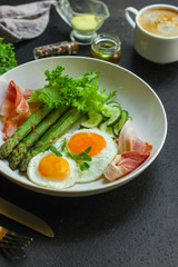 healthy food - breakfast (scrambled eggs, bacon, lettuce, asparagus, cucumbers, cheese, sandwich). food background. top view. copy space