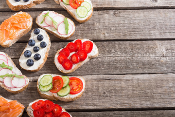 Variation of toast with fruit , vegetable and salmon