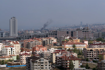 A major construction in Turkey's capital Ankara and rear smoke rising from a fire