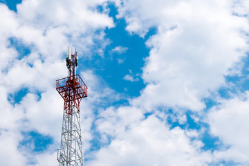 Tower with radar equipment, GSM communications antennas and transmitters against the beautiful blue...