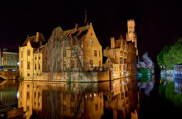 buildings on the canals of bruges by night
