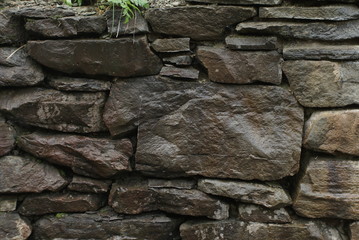 the wet wall is made of stones