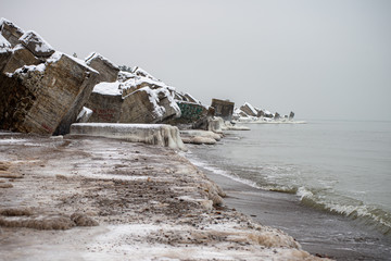 pieces of frozen ice in the lake in dim winter day