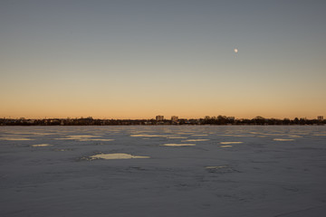 pieces of frozen ice in the lake in dim winter day