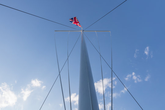 Union Jack flag atop a nautical flagpole in the high street in Marlow Buckinghamshire, UK