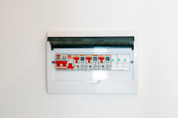 Electrical junction box on a white wall, close-up