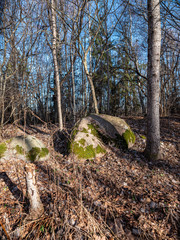 large rock in sand in countryside