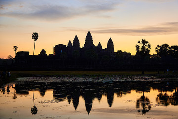 sunrise on angkor wat with reflection on water