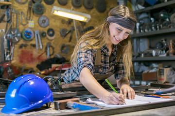 portrait of young woman working in a workshop