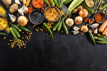Variety of fresh tasty vegetables on dark background