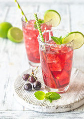 Two glasses of cherry mojito