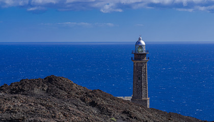 Faro de Orchilla lighthouse, with volcanic rocks and Alantic ocean landscape, El Pinar, El Hierro, Canary islands, Spain