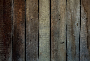 Wooden background of old boards painted with paint.  Old wooden fence
