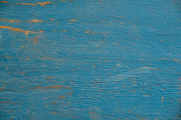 Wooden old cracked background painted blue paint.