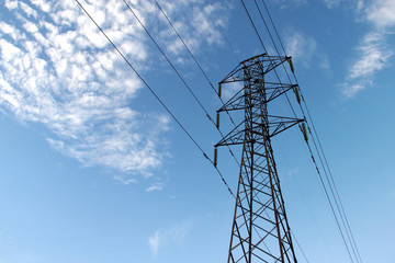 power transmission tower on background of blue sky